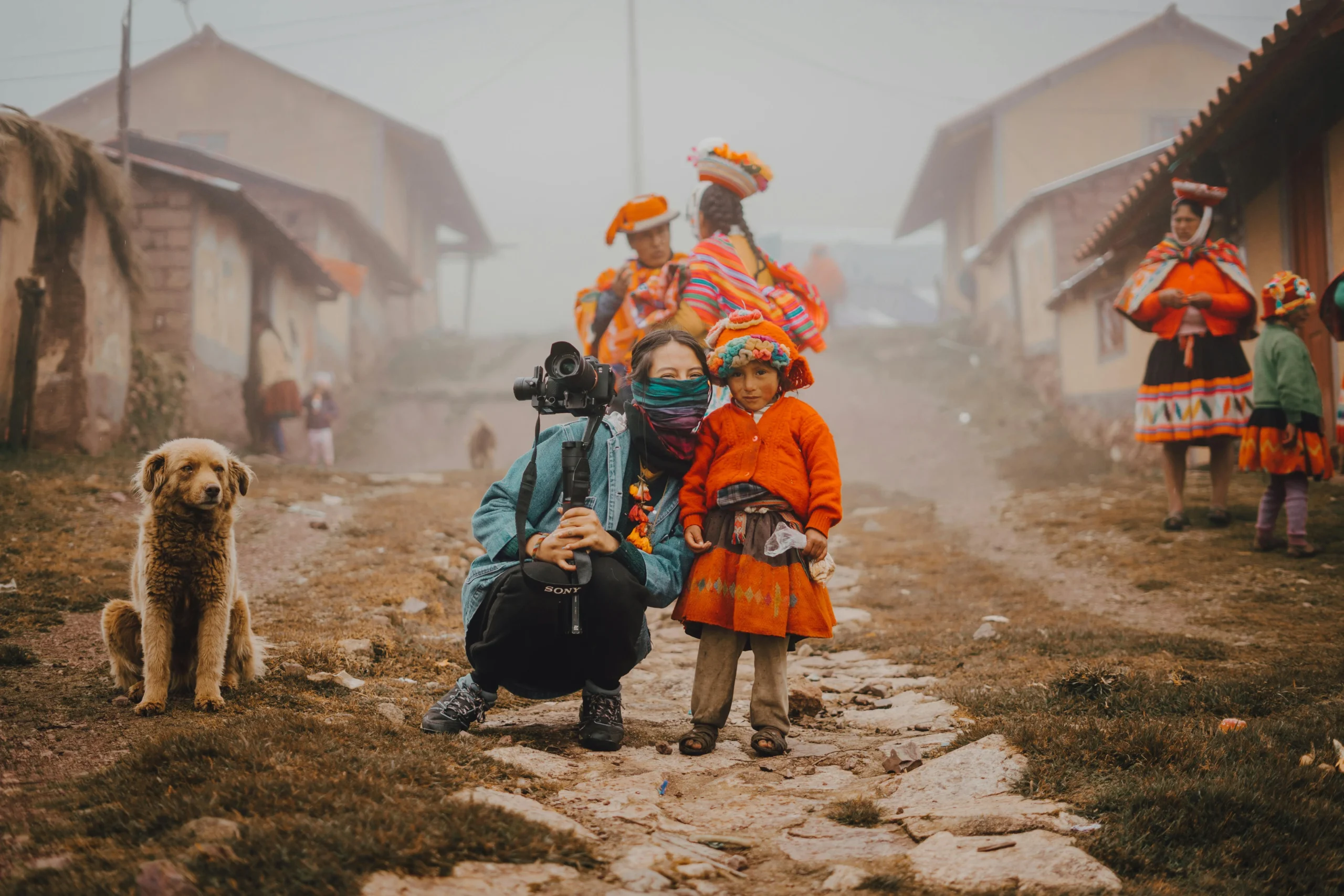 A tourist with a young girl from Ollantaytambo