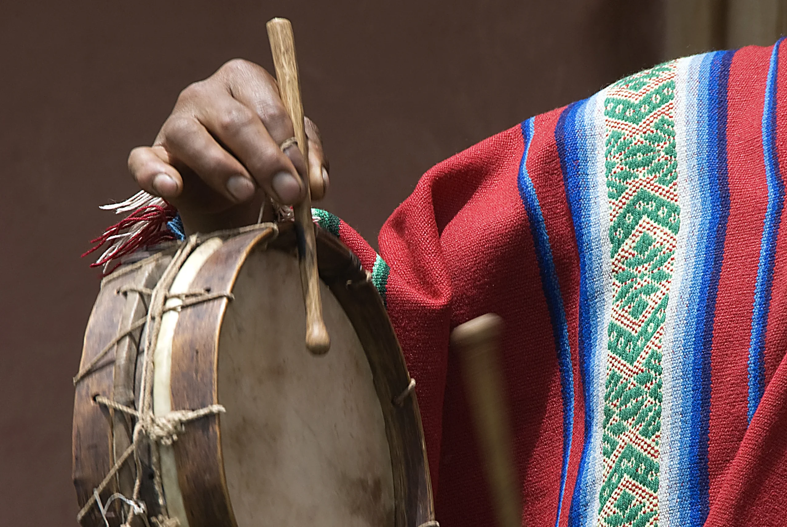 A men playing music in experiential tourism in Cusco