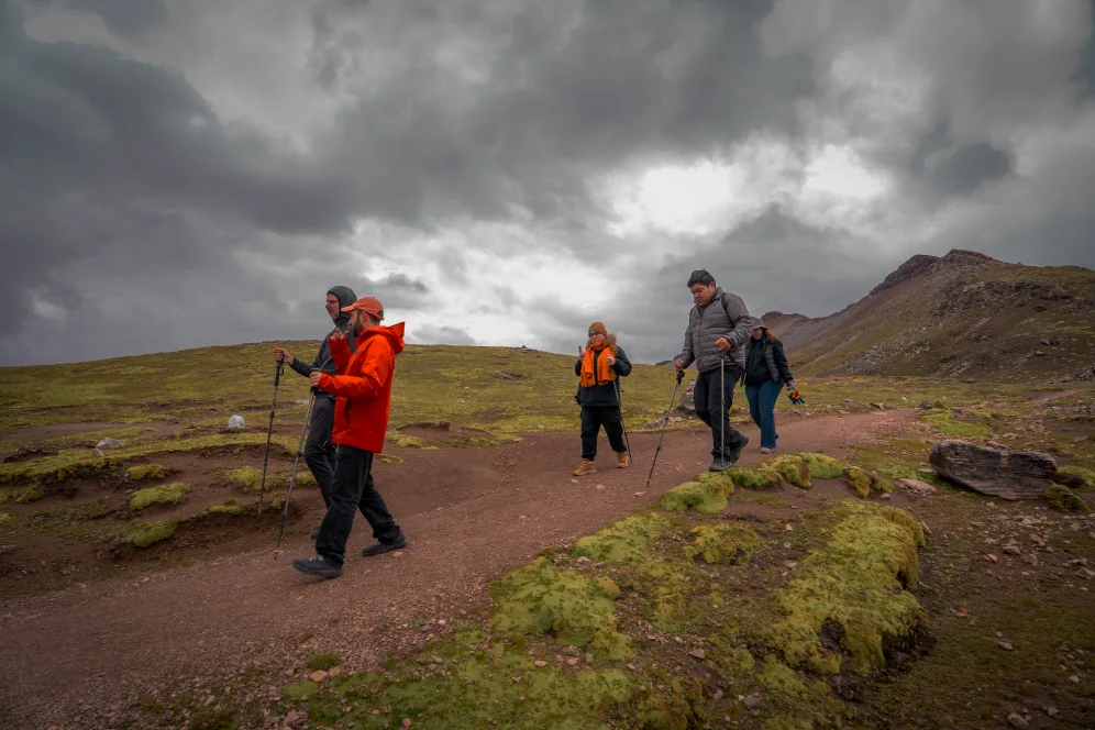Tourists hiking to Rainbow Mountain in Cusco Andes